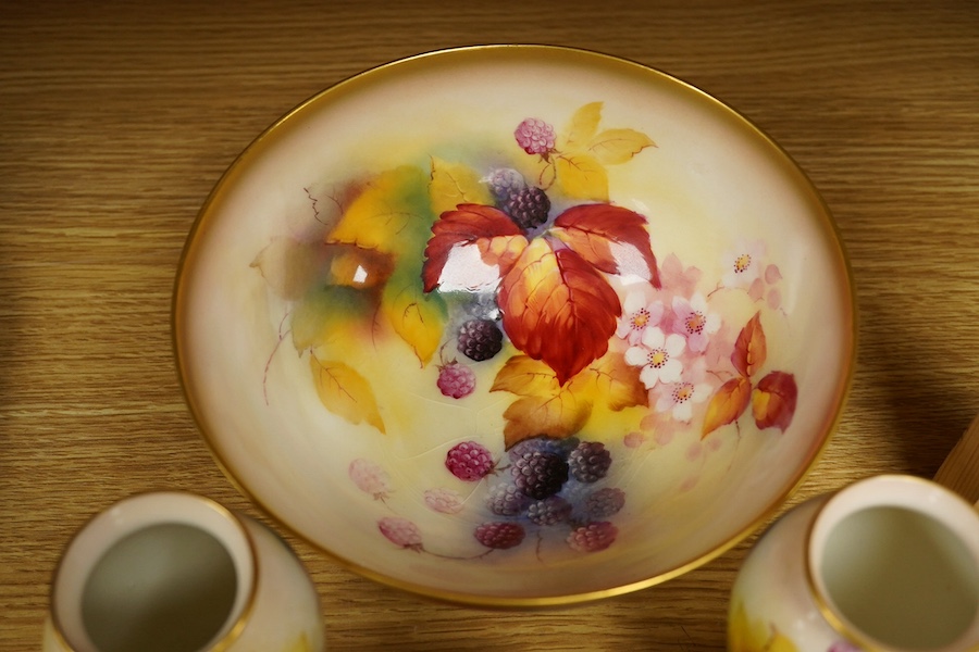 Four pieces of Royal Worcester porcelain hand painted with fruit and flowers by Kitty Blake, largest 18cm wide. Condition - good, bowl with hairline crack